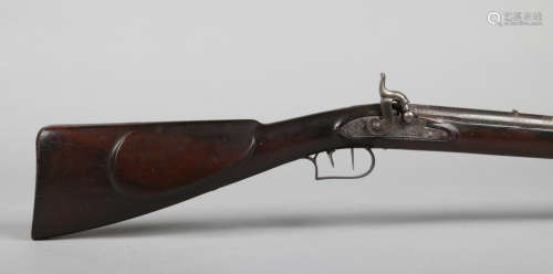 A 19th century large bore percussion sporting rifle musket. The barrel inlaid with silver stars,
