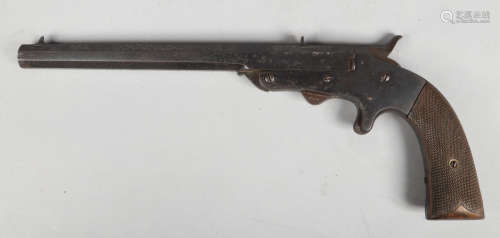 A late 19th century rimfire boot pistol. With knurled walnut scales and octagonal barrel. Barrel