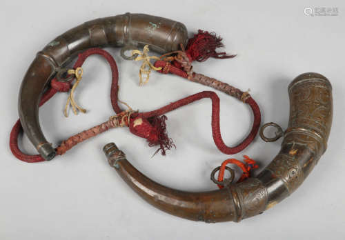 Two 19th century middle eastern horn shot flasks with brass mounts, largest 38cm.Condition report