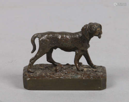 A miniature patinated bronze model of a labradour on canted rectangular plinth with naturalistic