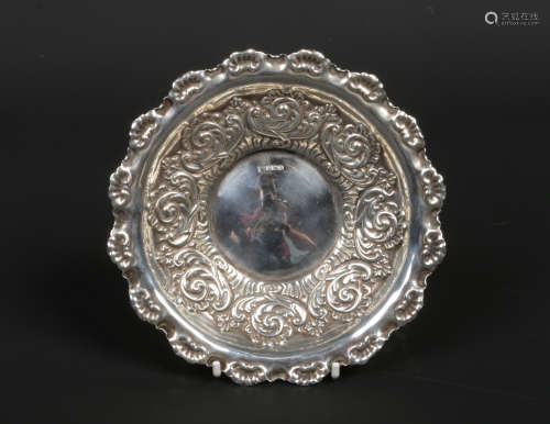 An Edwardian silver bon bon dish by Fenton Bros. With scalloped shell moulded rim and embossed