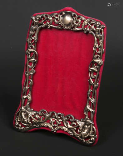 A late Victorian silver mounted easel photograph frame by William Comyns & Sons. Decorated with