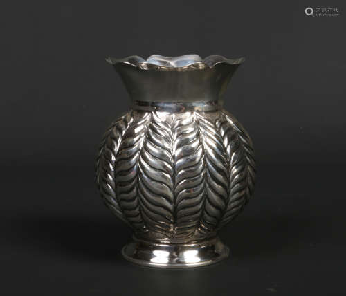 A Continental silver bulbous shaped vase decorated with stiff leaves. Marked 900.