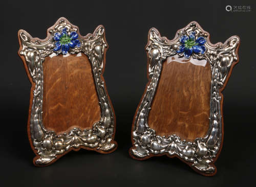 A pair of Art Nouveau silver mounted easel photograph frames by George Nathan & Ridley Hayes.
