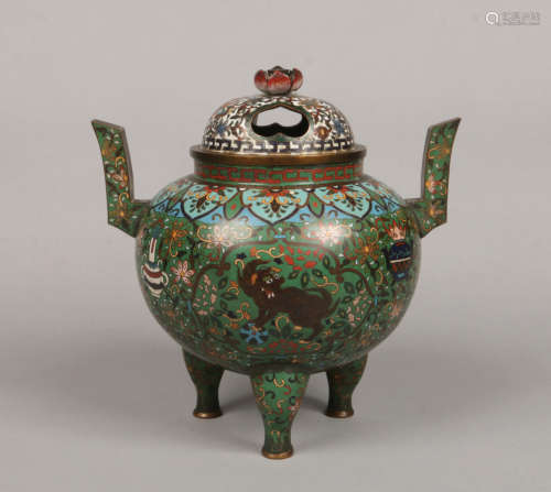 A 19th century Chinese cloisonne tripod temple censer and cover. With twin angular scrolling