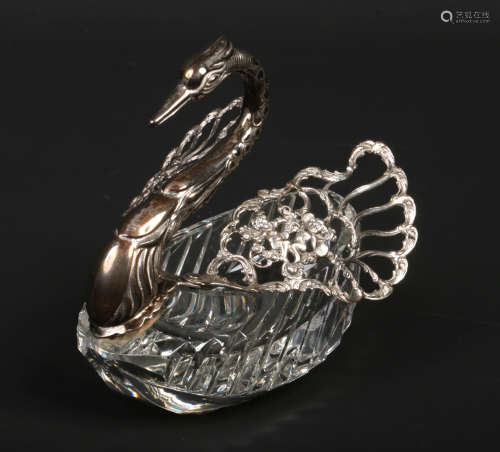 A sterling silver mounted cut glass trinket box modelled in the form of a swan. With folding