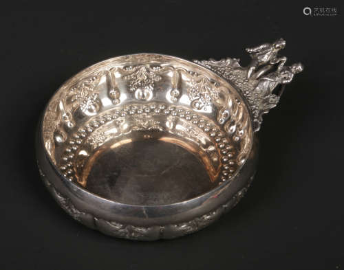 An early 20th century French silver wine taster by Marc Parrod. With loop handle and having a