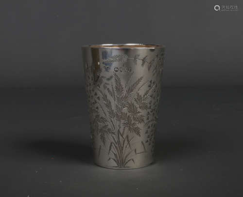 A Victorian silver beaker of tapering form possibly by Elizabeth Eaton. Engraved with flowers and