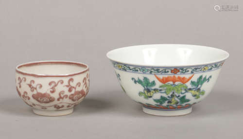 A Chinese bowl decorated in Wucai glazes with pears and fruit bats, six character Yongzheng reign