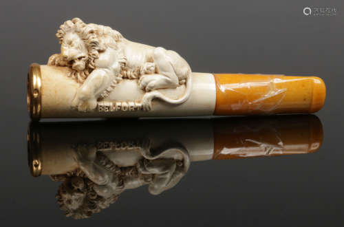 A French carved meerschaum cheroot holder with 18 carat gold mount. surmounted with a recumbent