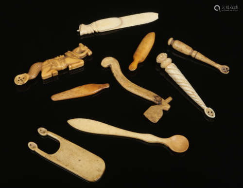 Six antique miniature carved bone spoons and three similar carvings. Largest 12cm.