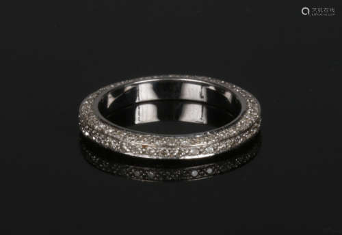 An 18 carat white gold eternity ring set with three rows of diamonds. 1.0ct total weight, VS, size