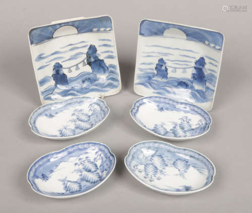 A pair of Japanese blue and white square formed dishes. Painted in underglaze blue to depict Meoto
