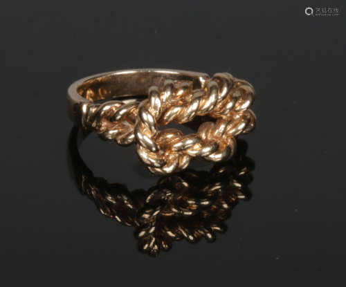 A 9 carat gold knot ring. 5.8 grams, size L.
