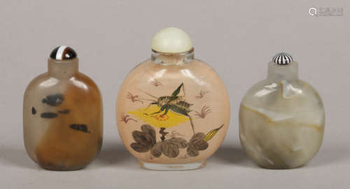 Three Chinese Peking glass snuff bottles including one painted inside out with a grasshopper and