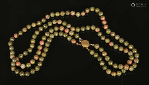 A two row jasper bead necklace with yellow metal clasp, 60cm.Condition report intended as a guide
