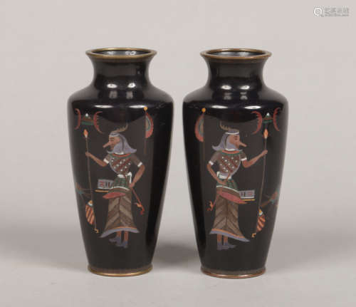 An unusual pair of Japanese Meiji period cloisonne vases. Black ground and decorated with Egyptian