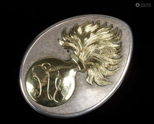 A silver and 18 carat gold mounted Royal Fusiliers sweetheart brooch of tear form. Set with the