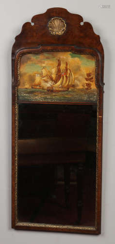 A Queen Anne style walnut framed pier mirror. Painted to the pediment with French and British Navy