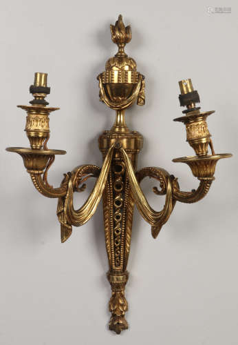 A pair of early 20th century Neo-Classical gilt bronze twin branch wall sconces, 49cm.Condition