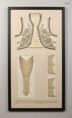 Turkish Ottoman textiles framed as one. Including a child's waistcoat silk lined and with gold
