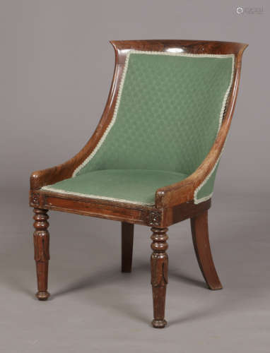 A Regency carved rosewood library chair. Condition report intended as a guide only.Some water damage
