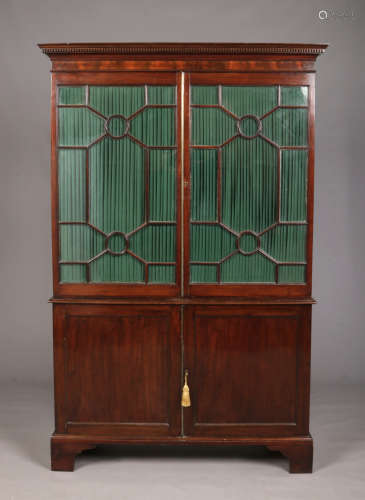 A George III mahogany bookcase. With brass door mouldings, astragal glazed doors, fitted interior