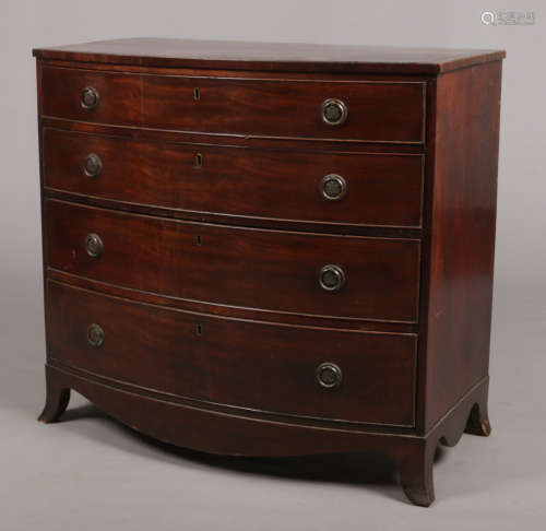 A Regency mahogany bow front chest of four graduated drawers with crossbanded top. Chestnut lined,