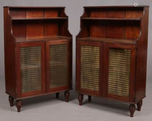 A pair of 19th century mahogany waterfall bookcases. With reeded mouldings and raised on turned