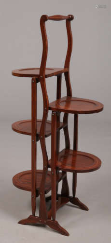 An Edwardian inlaid mahogany double sided four tier folding cake stand, 89cm.Condition report