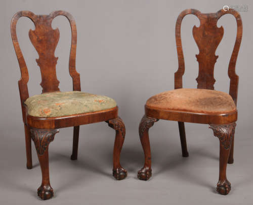 A pair of Queen Anne walnut side chairs. With flat baluster splats and raised on carved cabriole