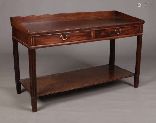 A George III mahogany two tier serving table. With a pair of frieze drawers, reeded inlays and