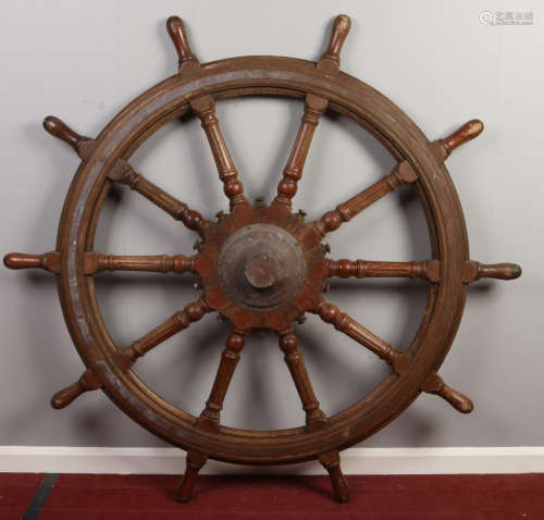 A 19th century large hardwood ten spoke ships wheel with metal mounts, 164cm wide. Condition