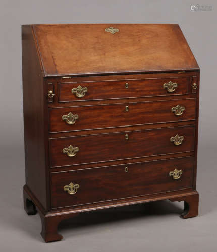 A Victorian mahogany bureau of small proportions, with oak drawer linings, fitted interior and