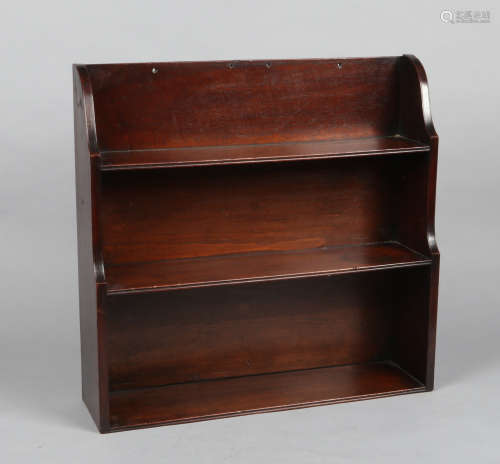 An early 19th century mahogany three tier waterfall hanging bookcase, 61.5cm wide.Condition report