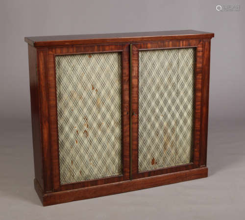 A Regency mahogany bookcase cabinet in the manner of Gillows.
