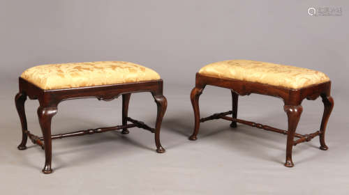 A pair of 18th century carved walnut stools in William & Mary style. With plain cabriole supports,