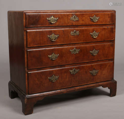 A George I walnut caddy top chest of four graduated drawers. Crossbanded, with original brightwork