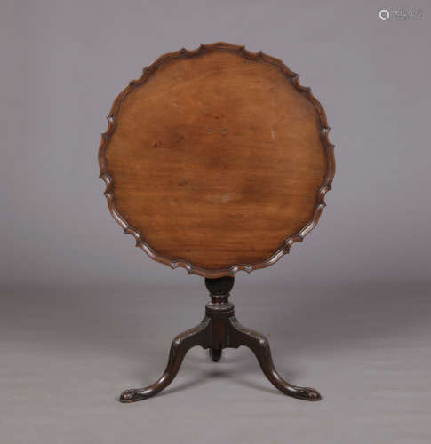 A 19th century mahogany Chippendale style tilt top supper table. With scalloped dish top and