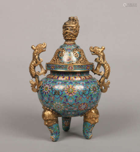 A Chinese cloisonne tripod temple censer and cover. Blue ground and decorated with stylized lotus