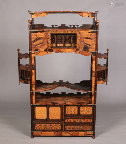A Japanese Meiji period shodana display cabinet. Inlaid with parquetry panels of specimen woods,