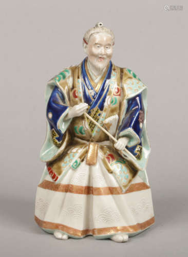 A Japanese Meiji period polychrome porcelain figure of an archer, 23.35cm.Condition report