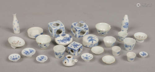A collection of Japanese Meiji period porcelain toy wares / dolls house miniatures. Various forms