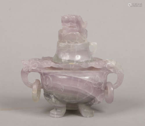 A 20th century Chinese carved green and lilac flourite censor and cover. Ornamented with mythical