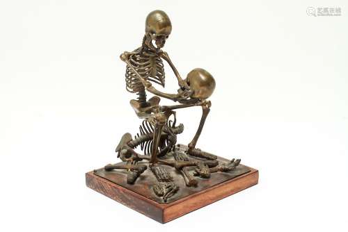 Human Skeleton Holding a Skull Brass Sculpture