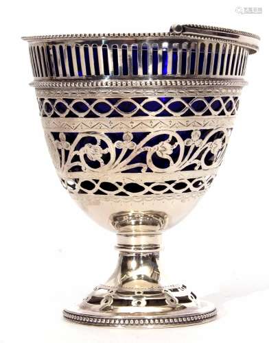 Unmarked white metal table sugar basket in the form of a footed pail with hinged handle, pierced and