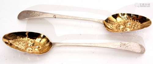 Two George III Old English pattern table spoons with later gilt lined and fruit embossed bowls and