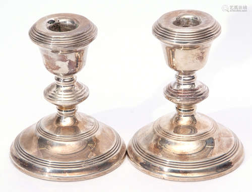 Two Elizabeth II squat candlesticks, height 12.5cm (loaded), Birmingham 1972/73, maker's mark B&