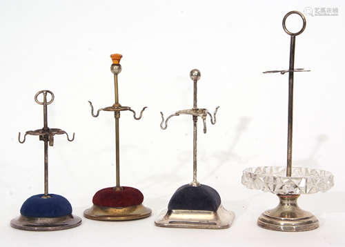 Mixed Lot: comprising four various hat pin stands comprising one with stepped circular base to a