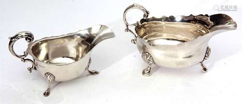 Mixed Lot: comprising two various sauce boats, each of polished form with cut card rims and leaf